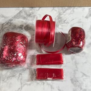 Different red ribbons, most unopened, one is used.